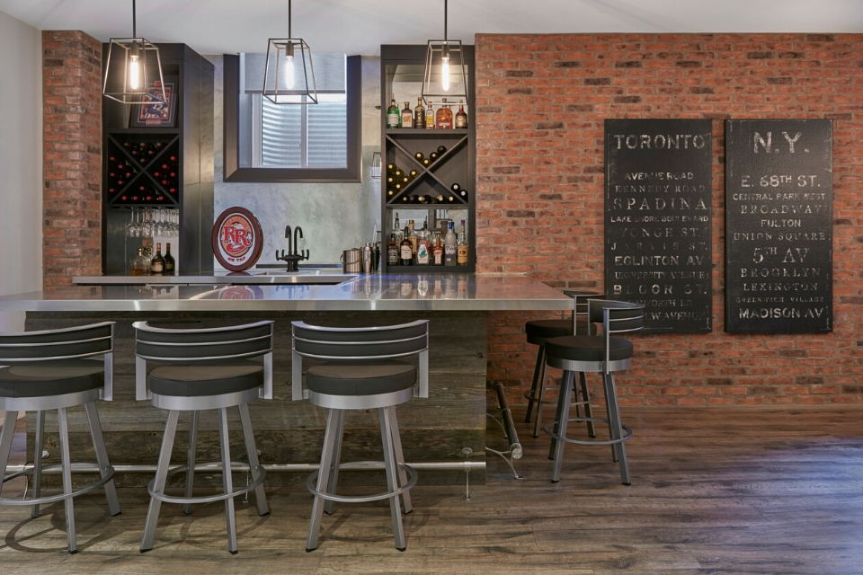 metal basement bar, brick walls, rustic vinyl flooring | Design by Cynthia Soda